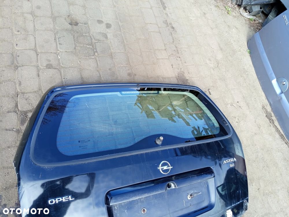 KLAPA TYLNA OPEL ASTRA 2 KOMBI ZAMEK SILNICZEK STOP BLENDA - 16