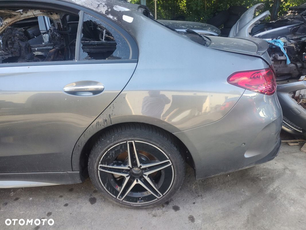 MERCEDES C-KLASA W206 SEDAN BŁOTNIK TYŁ LEWY