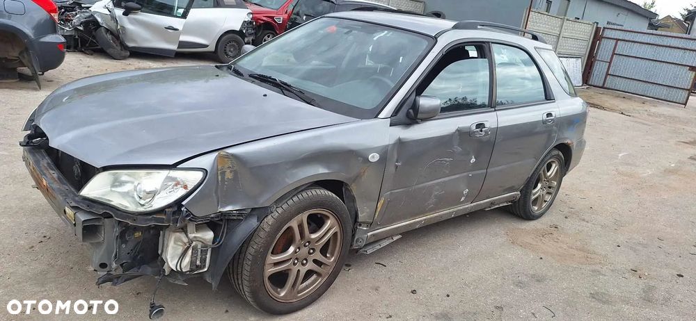 SUBARU IMPREZA II lift 45A kombi lampa lewy przód - 1