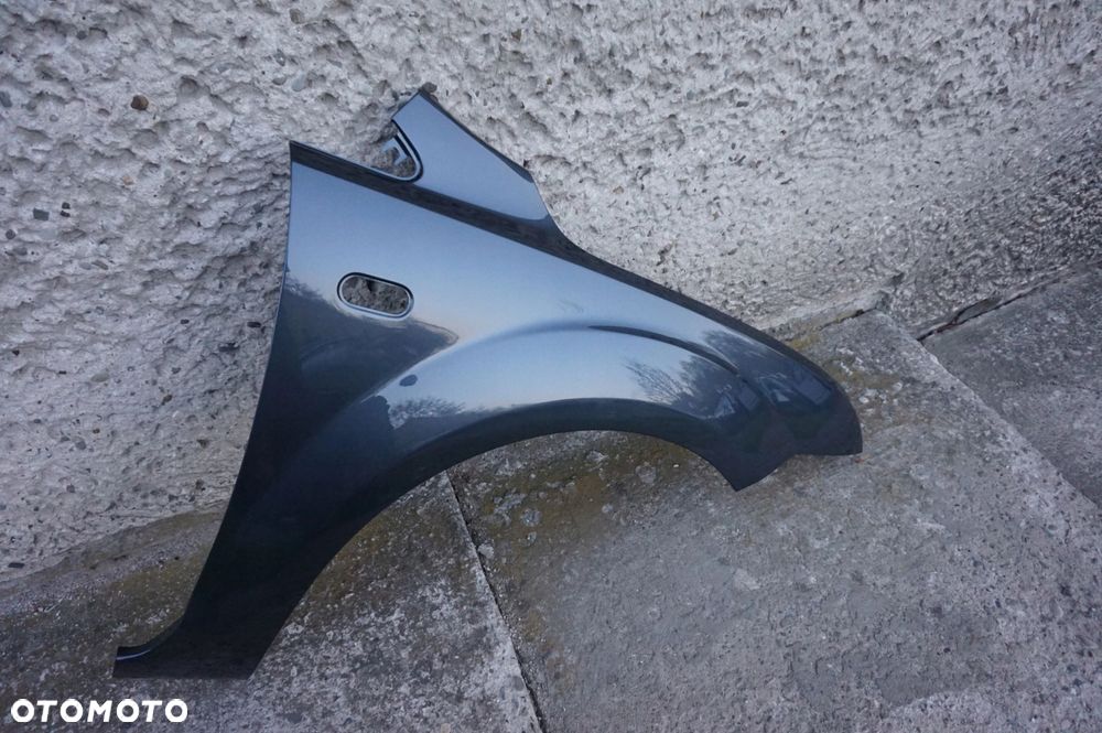 BŁOTNIK PRAWY FOCUS II MK2 04/08r H4 - 3