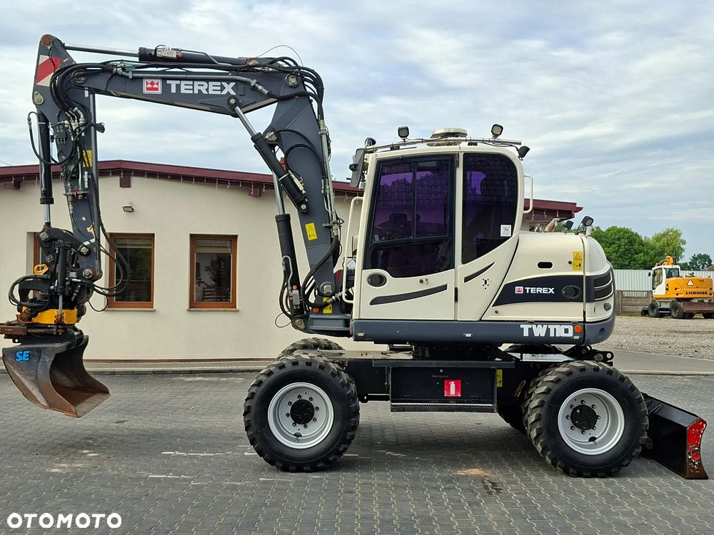 Terex SCHAEFF TW110 ROTOTILT ze szczypcami - 1