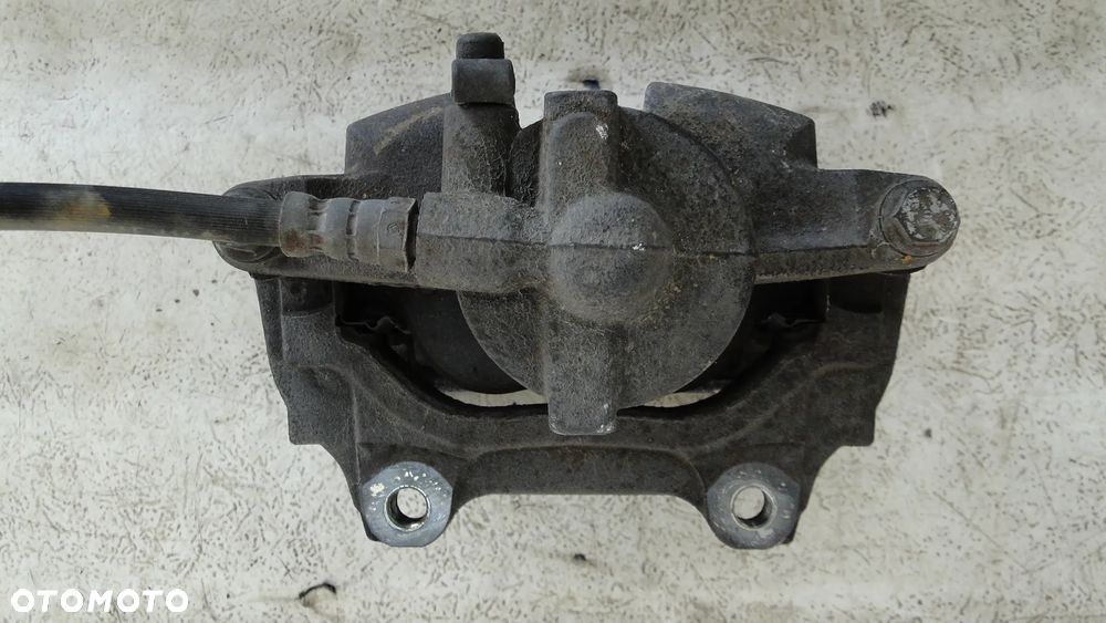 LANCIA MUSA FIAT IDEA ZACISK HAMULCOWY LEWY PRZÓD PRZEDNI 1.9JTD - 4