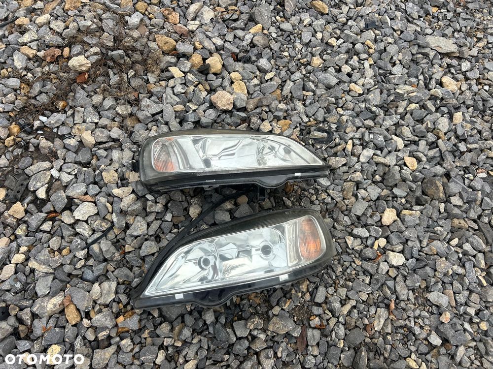 KL Lampa Przód Lewa Prawa Lewy Prawy Przód Opel Astra G 98- TYC - 2