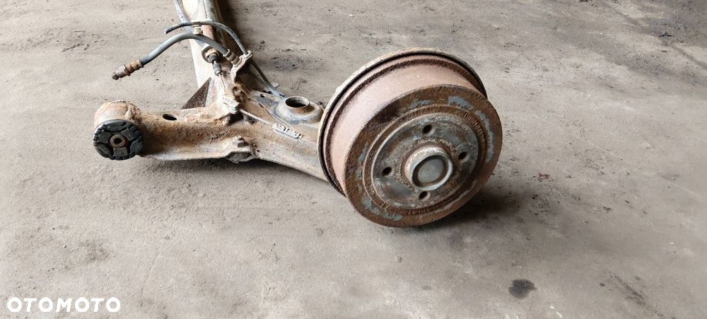 BELKA OŚ ZAWIESZENIA TYŁ BĘBNY Z ABS OPEL CORSA C HB 3D - 4