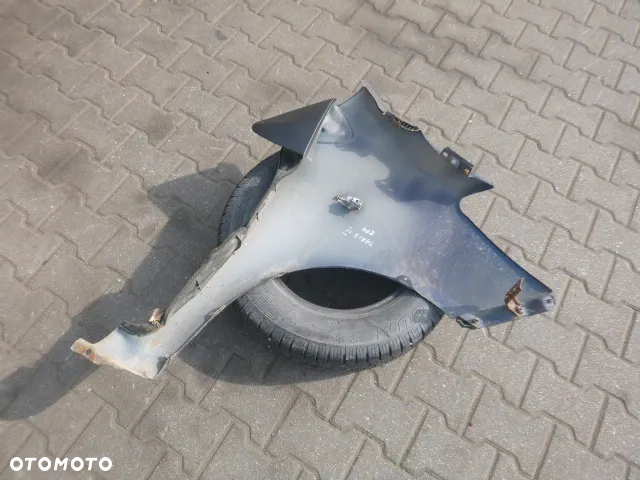 BŁOTNIK LEWY PRZÓD LEWY PRZEDNI TOYOTA YARIS II KOLOR 8P4 05-09 - 8