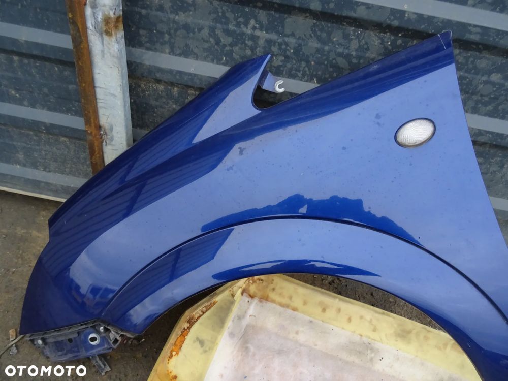 Błotnik Opel Meriva A lewy przód niebieski - 4