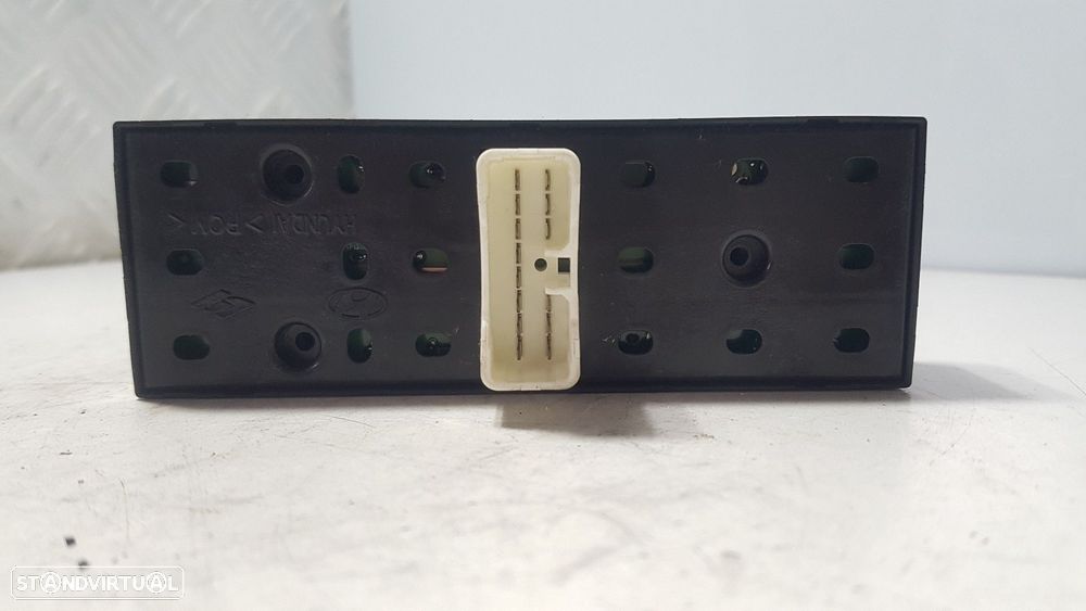 COMANDO ELEVADOR DE VIDRO FRONTAL ESQUERDO KIA CARENS II LIMUSINA 2006 - 2