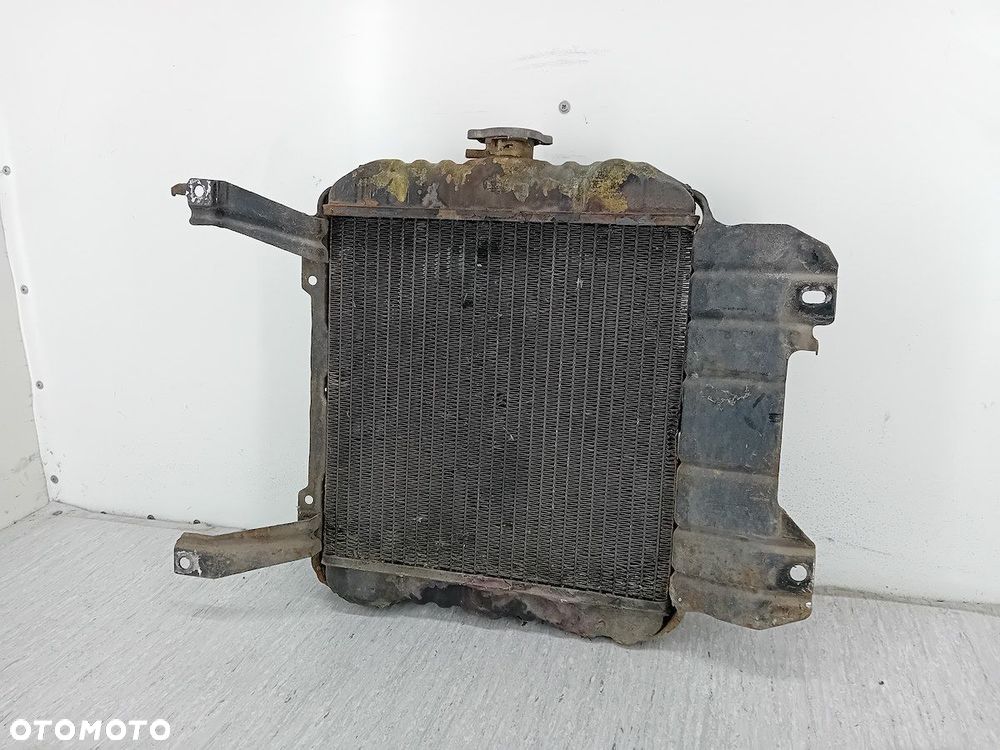 CHŁODNICA WODY Z WENTYLATOREM NISSAN SUNNY B11 1.3 - 5