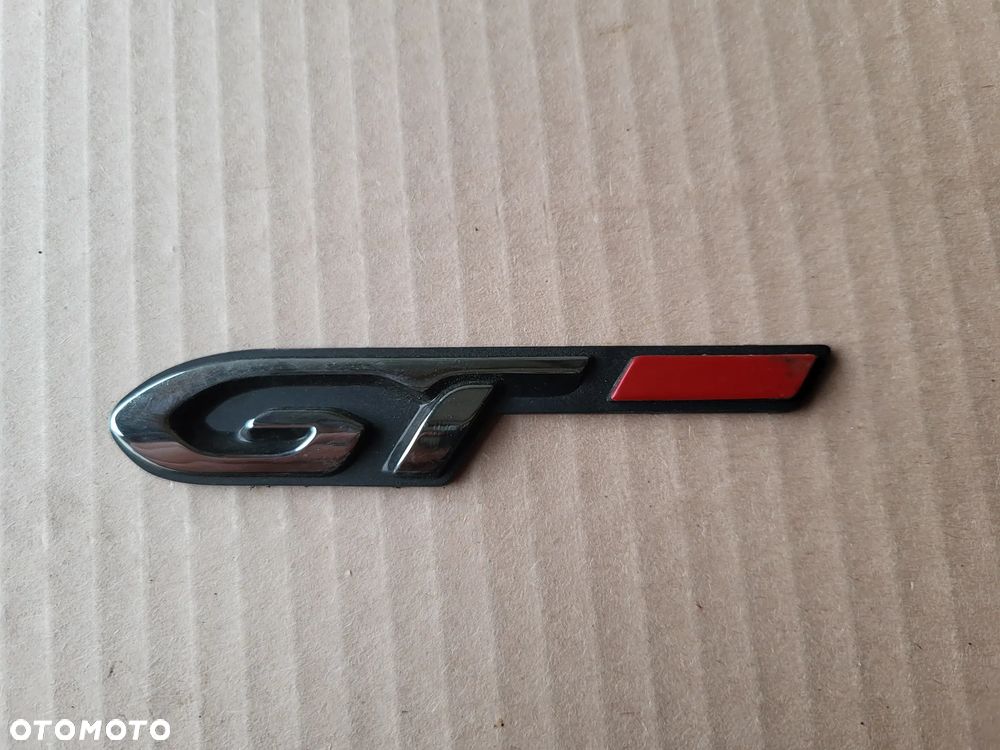 Znaczek emblemat monogram na błotnik lewy Peugeot 308 T9 - 1
