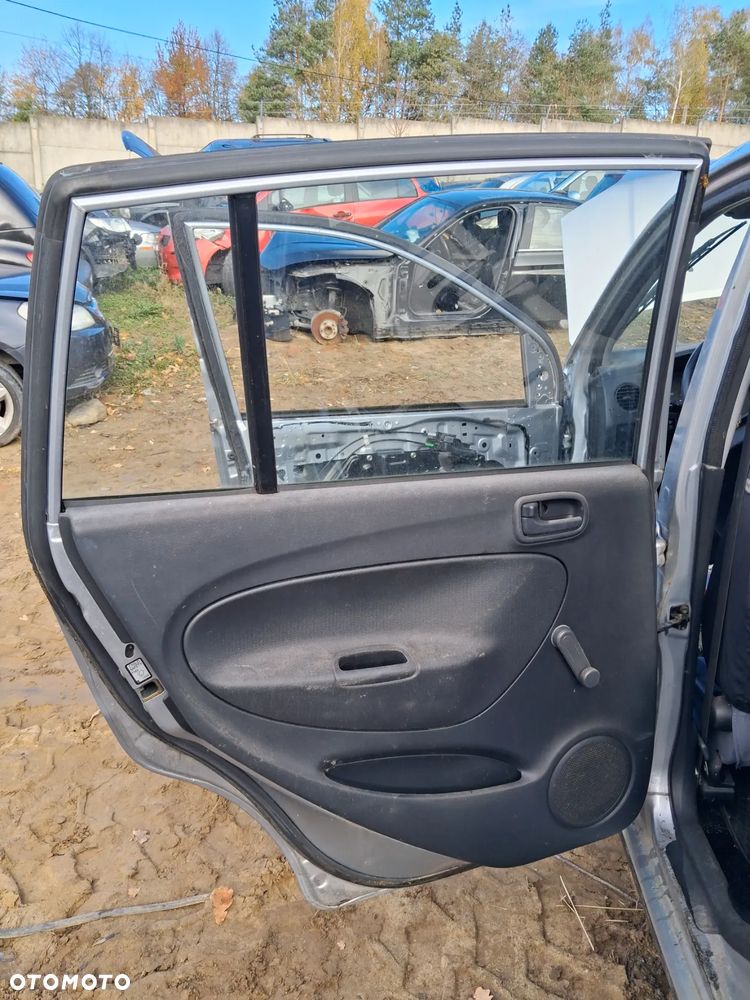 Daihatsu cuore 03 drzwi lewy tyl E28 - 7