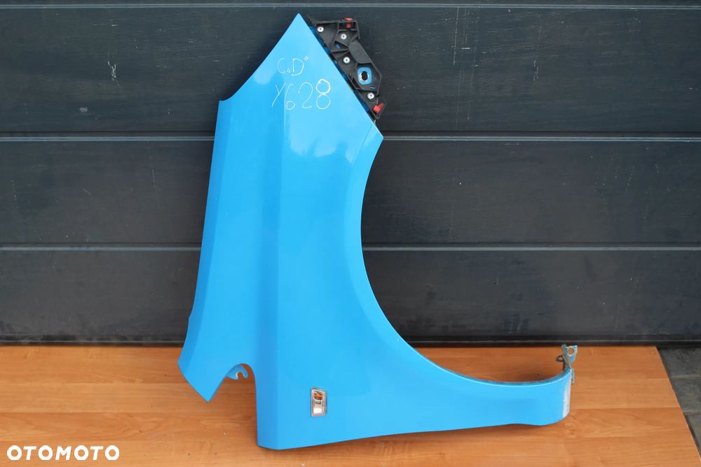 BŁOTNIK PRAWY PRZÓD PRZEDNI PRAWY OPEL CORSA D Y628 ZE ŚLIZGIEM