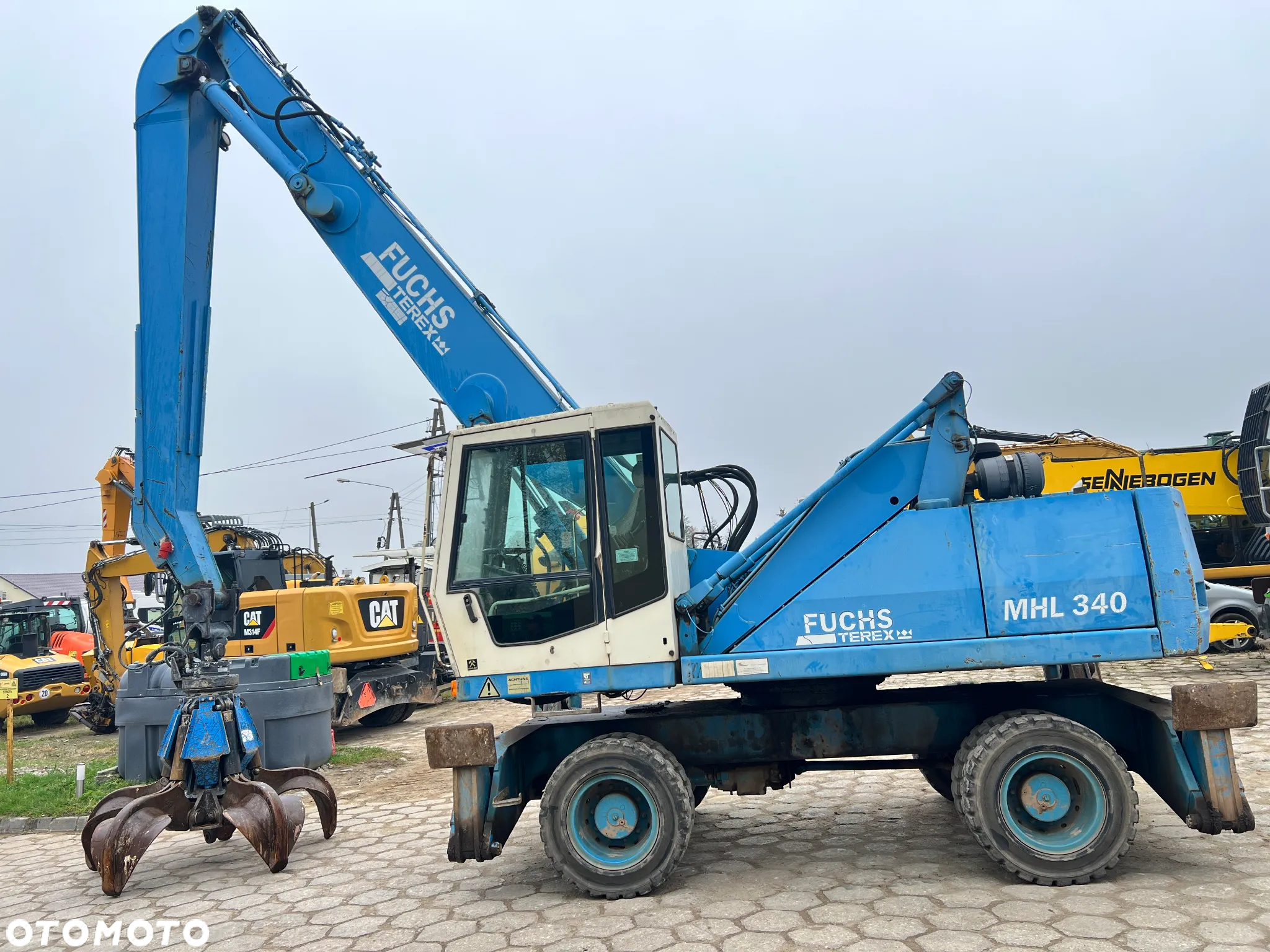 Fuchs MHL340 340 chwytak do złomu FUCHS 0,9m3 - 2
