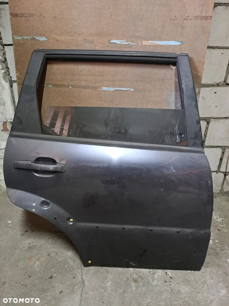 Drzwi Ssangyong Rexton I 01-07' prawy tył (czarne) - 1