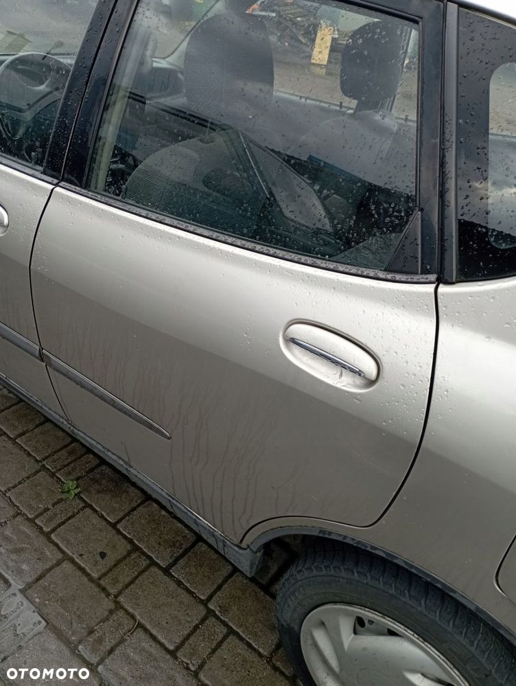 DAIHATSU SIRION I DRZWI LEWE TYŁ TYLNE GOŁE - 1