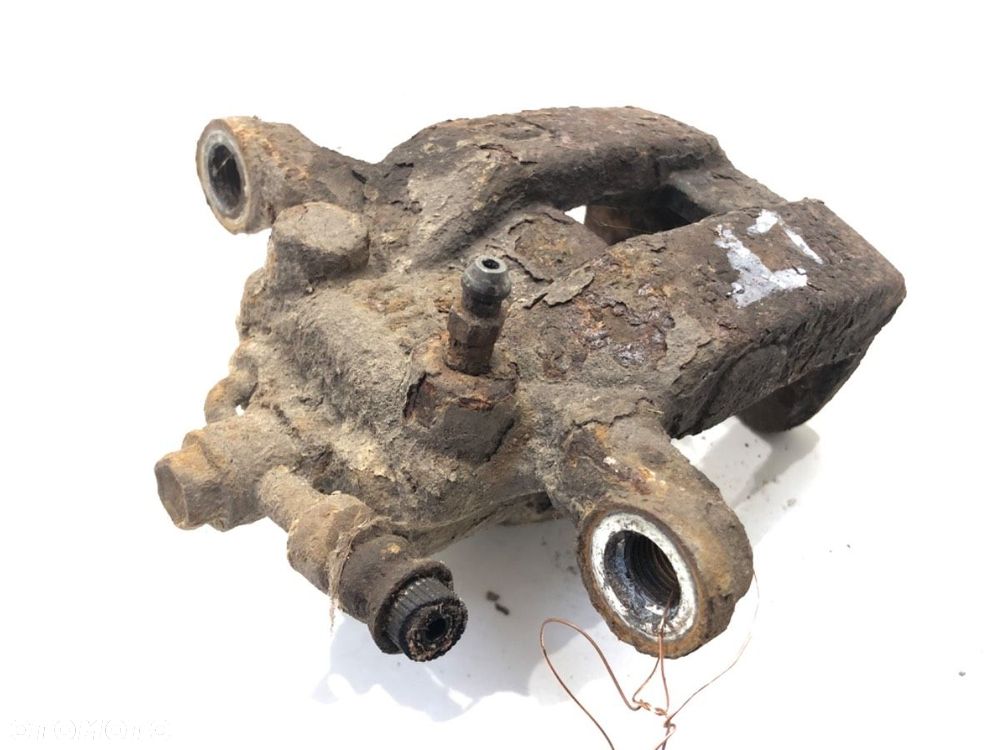 ZACISK LEWY TYŁ  NISSAN QASHQAI / QASHQAI +2 I (J10, NJ10, JJ10E) 2006 - 2014 2.0 Napęd na - 2