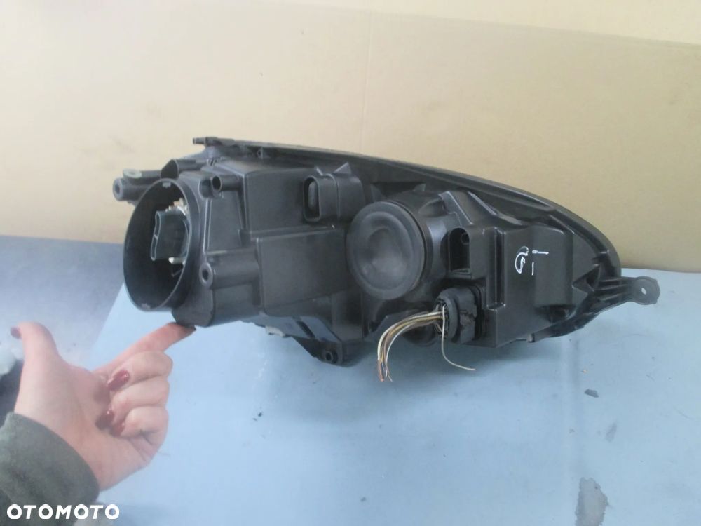lampa lewa Golf V GT Hella Europa - 4