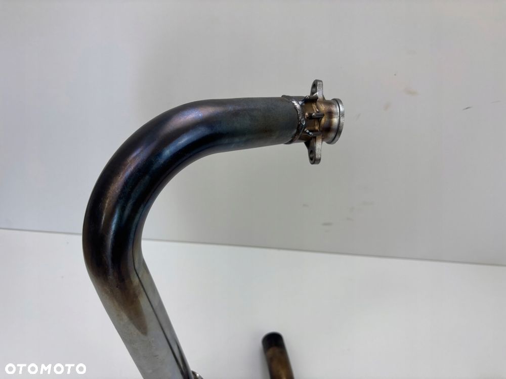 Lewy kolektor Triumph Bonneville T100 908 MD 01-04 Oryginał - 2