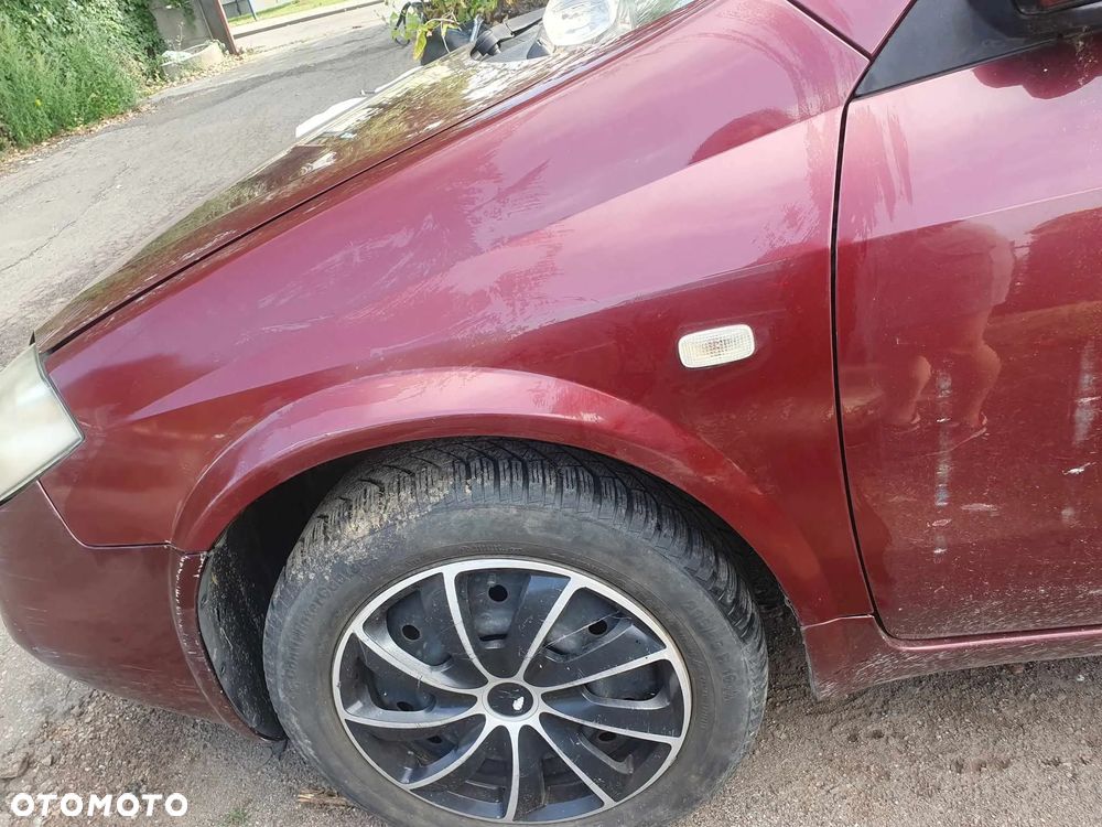 Nissan Primera  P12 HB Błotnik lewy,prawy. - 5