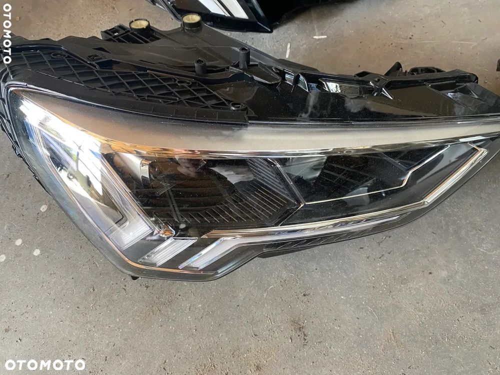 REFLEKTOR AUDI Q3 83A941033 83A941034 - 2