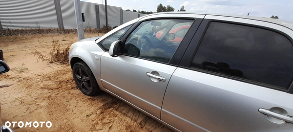 SUZUKI SX4 DRZWI LEWY PRZÓD PRZEDNIE LEWE KOMPLETNE Z2S nr. 18/9