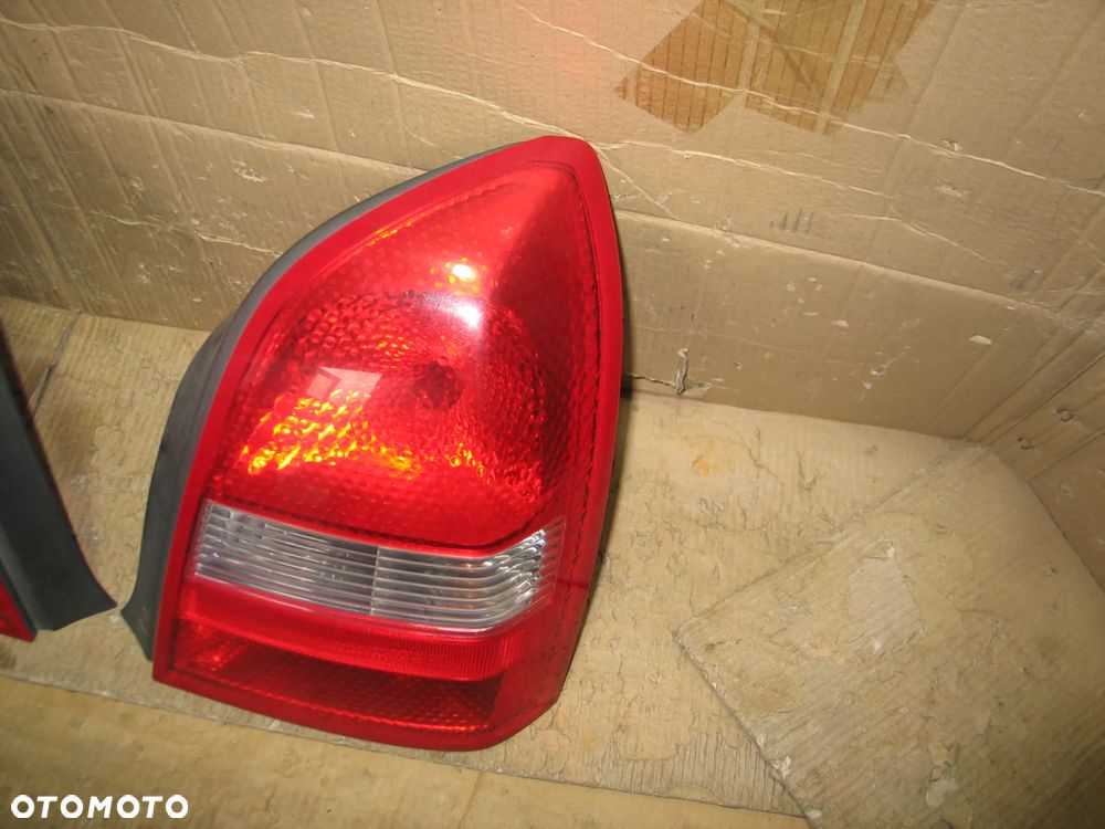 lampa tyl prawa lewa nissan primera P12 sedan oryginal - 8