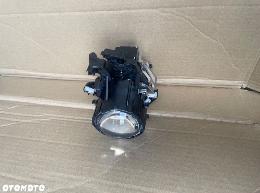 62611913 Soczewka lampy xenon bmw e90 e91 - 1