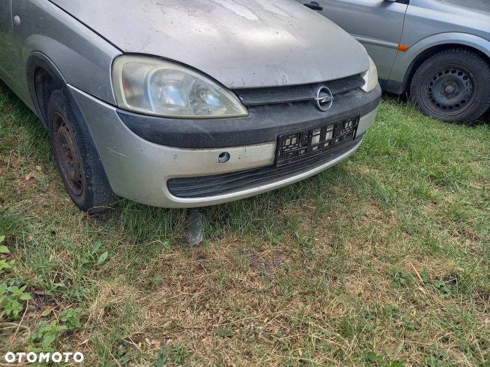 części OPEL CORSA C hatchback 3drzwi 1.0 benzyna 2002r. Srebrny LAMPY PRZÓD prawa lewa - 1
