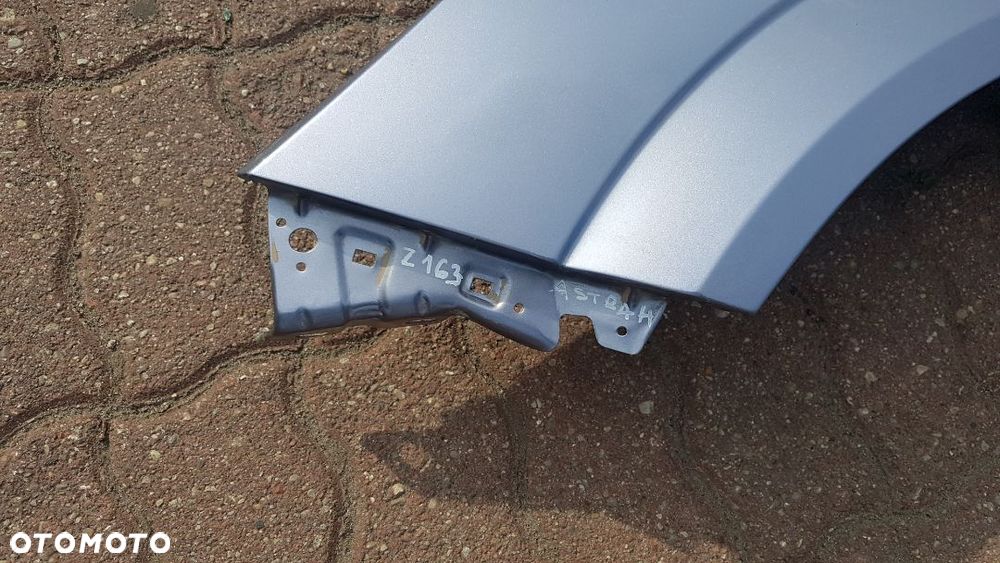 Błotnik przód  lewy  Opel Astra H III kod lakieru Z163 - 2