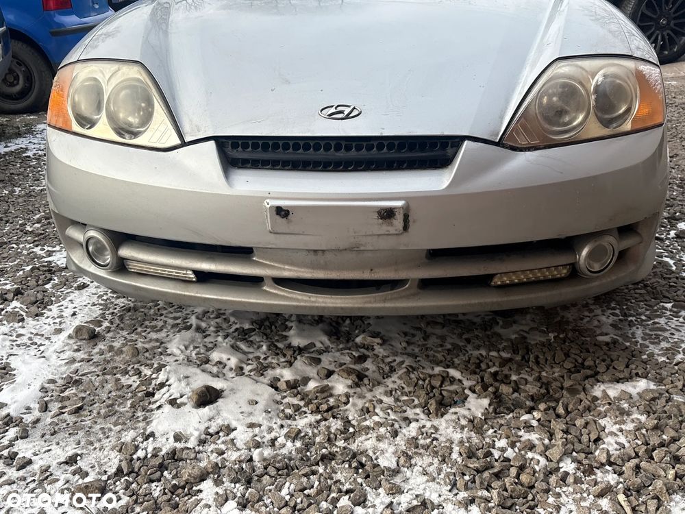 ZDERZAK PRZEDNI HYUNDAI COUPE 2002R KOD LAKIERU LS - 1
