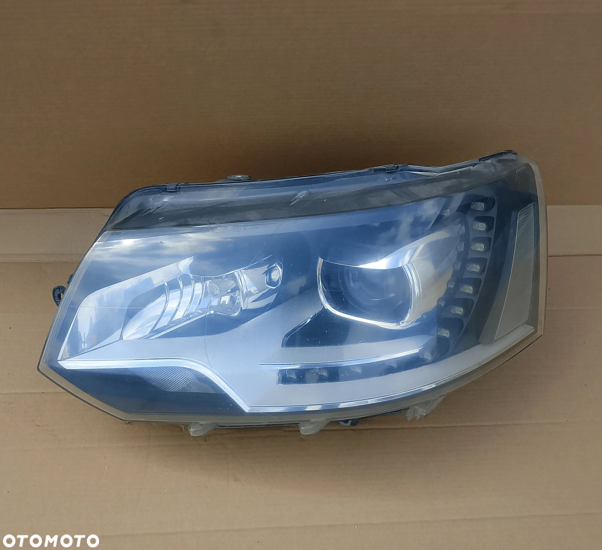 Lampa Bi-xenon lewy Volkswagen T5 Lift Europa 7E5941015 - 1