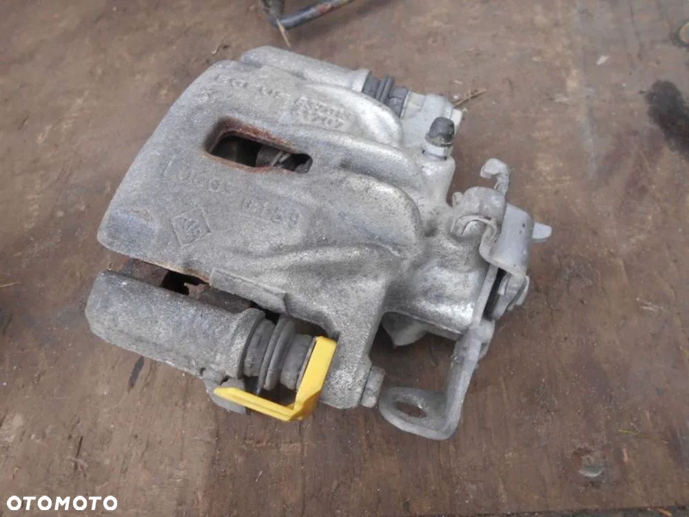 TRAFIC III VIVARO 14-19 ZACISK HAMULCOWY TYŁ LEWY - 1