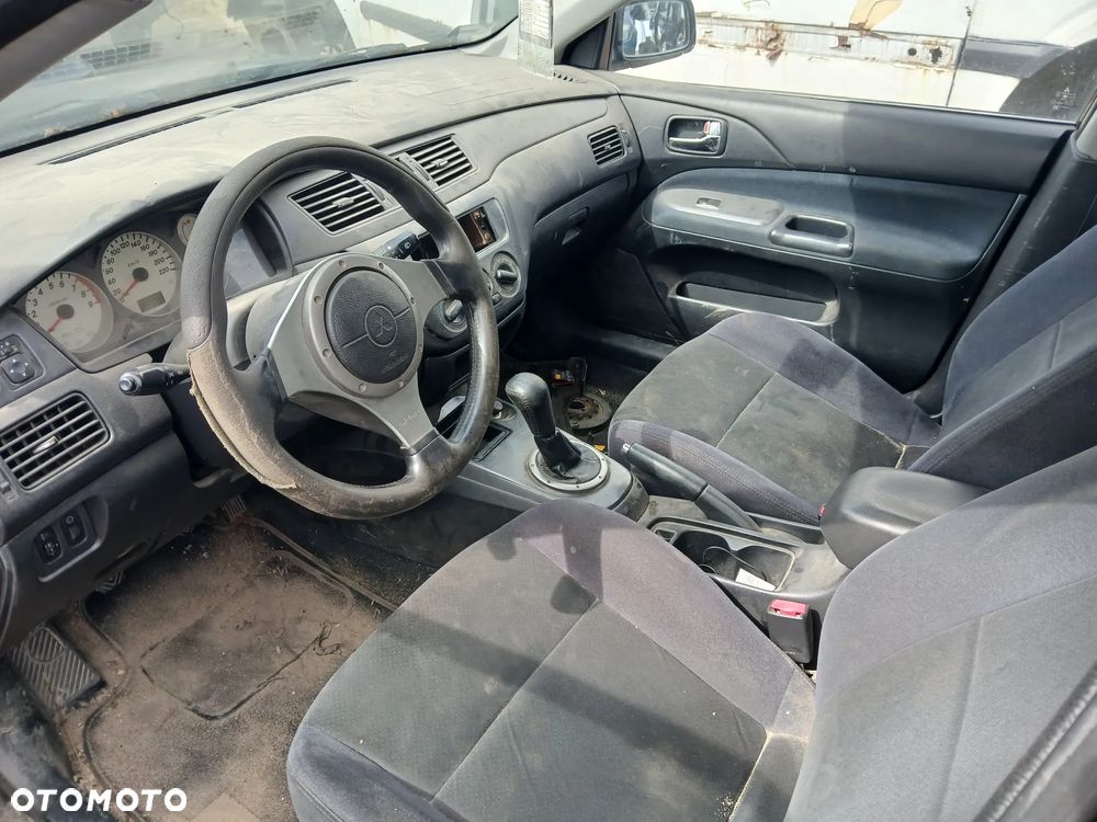 mitsubishi lancer VII fotel kanapa deska kokpit podsufitka boczek podłokietnik licznik panel szyb - 2