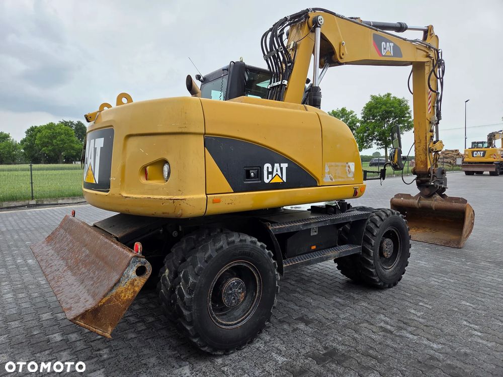 Caterpillar M313D / spr. ze Szwajcarii / - 4