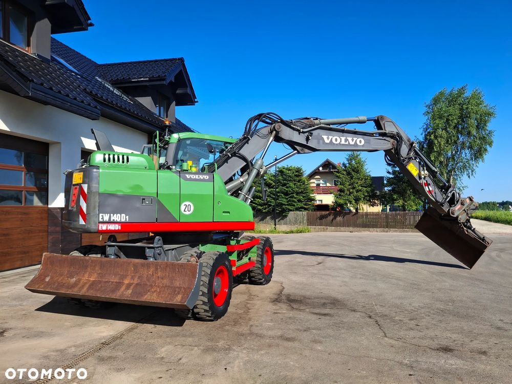 Volvo EW 140D Koparka Kołowa OilQuick Szybkozłącze Podwójne Koła 2015 Rok 2439 MTH Moc: 204 KM Dodatkowa Łyżka Pług Bardzo Dobry Stan Sprowadzona - 17