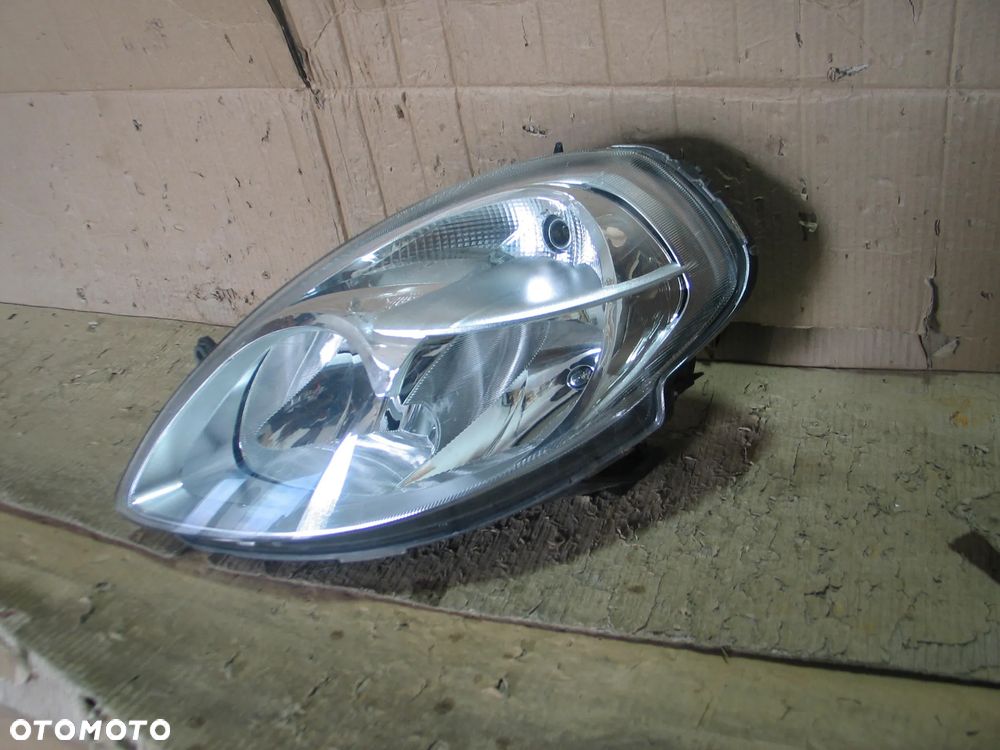 lampa przod lancia ypsilon 2 II lift 06-11r. oryginal europa - 8