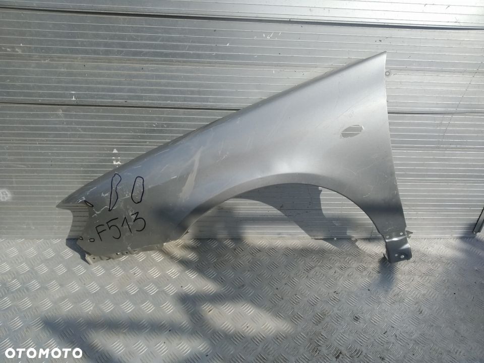 F513 LEWY BŁOTNIK SUBARU IMPREZA 2005- - 1