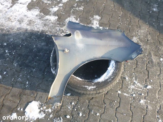 BŁOTNIK LEWY PRZÓD LEWY PRZEDNI OPEL CORSA D Z168 - 12