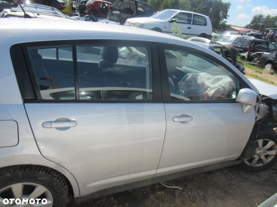 ZAMEK DRZWI PRAWY PRZÓD NISSAN TIIDA - 1
