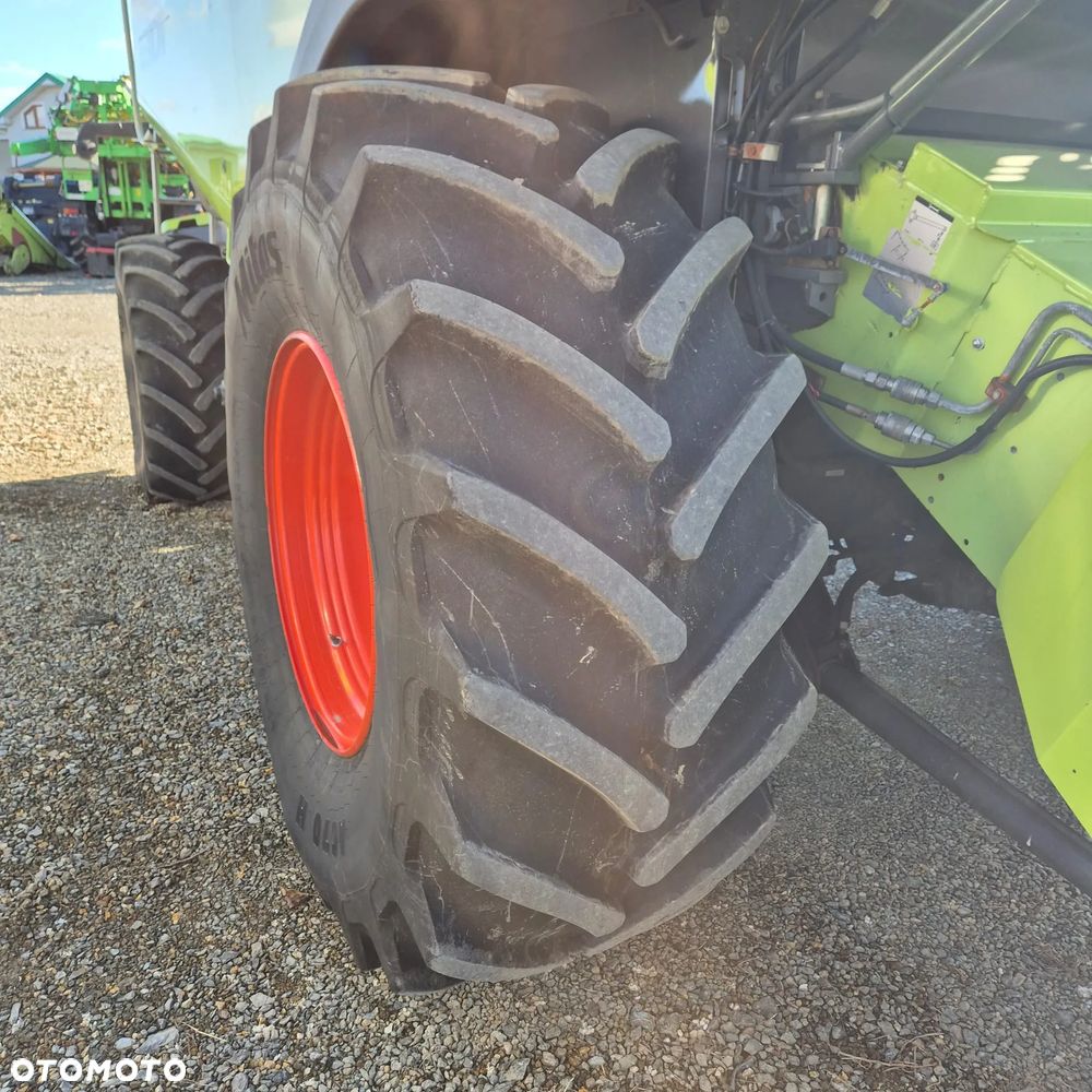 Claas Lexion 650 z hederem - 23