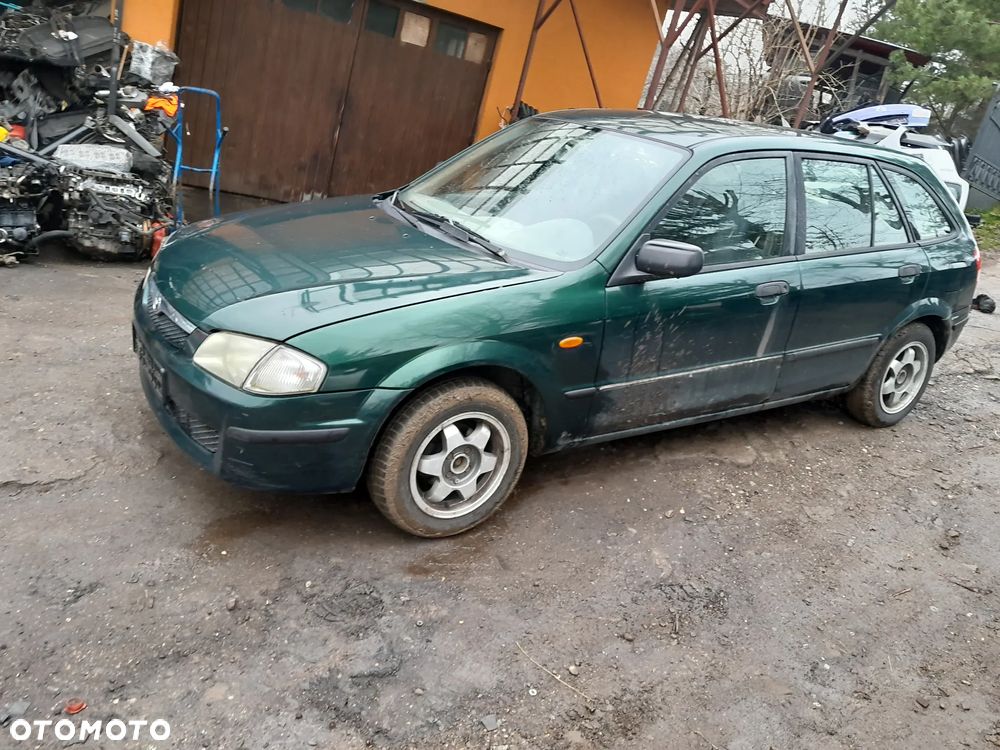 Mazda 323 323f 323  BJ 98-03  Maska lampa zderzak pas zamek w kolor SU - 7