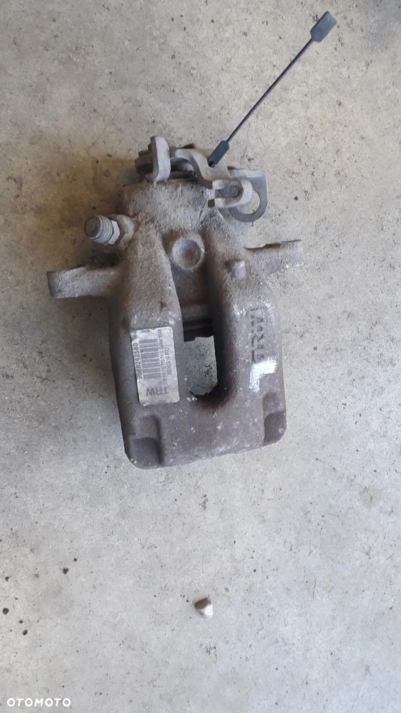 citroen c4 I lift 1.6 VTI zacisk tył lewy - 1