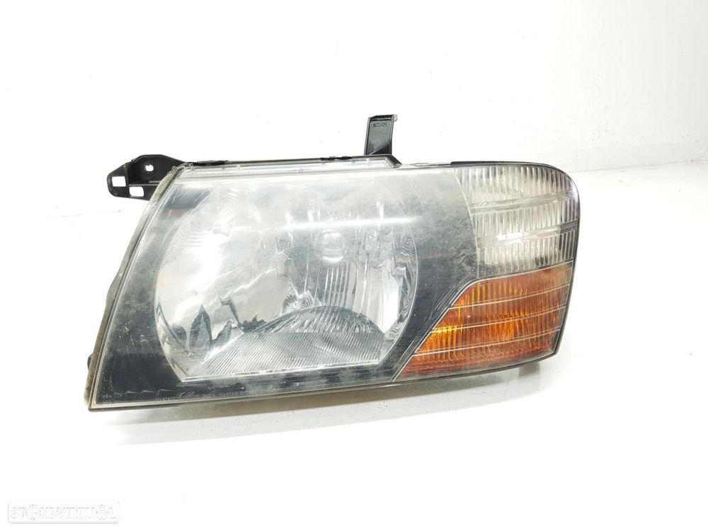 FAROL ESQUERDO MITSUBISHI MONTERO V60V70 - 1