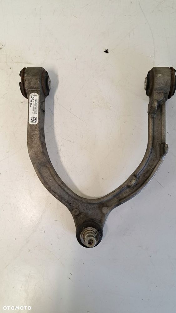 Wahacz lewy górny TESLA model Y 1288321-00-A - 2