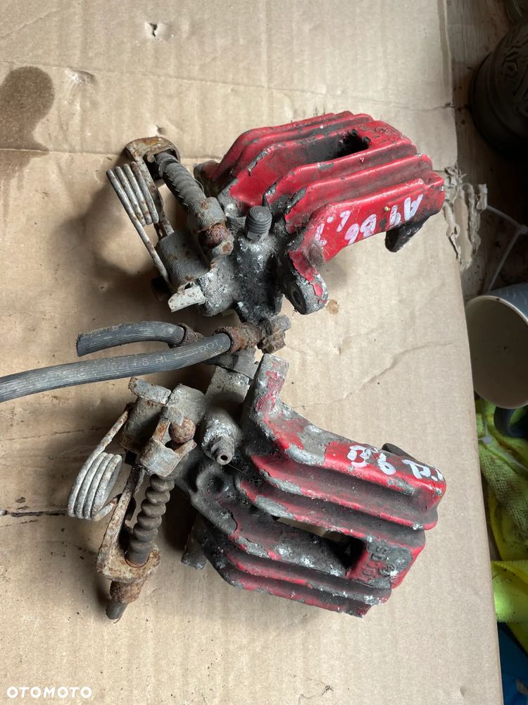 ZACISK HAMULCOWY AUDI A4 B6 B7 TYŁ LEWY PRAWY - 1