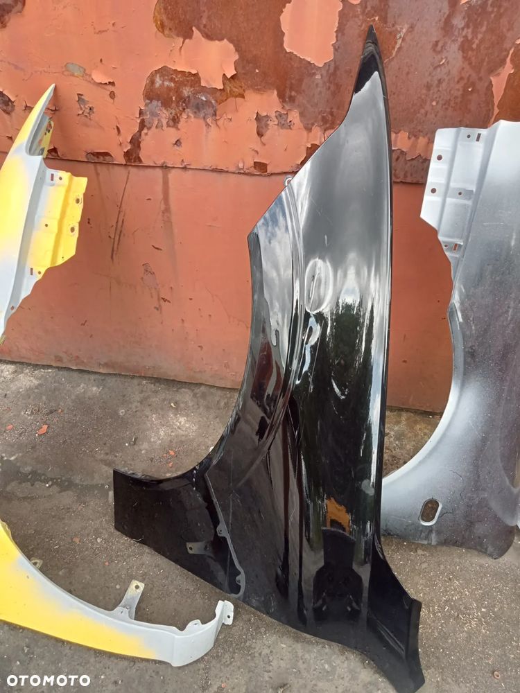 BŁOTNIK LEWY PRZÓD VOLVO XC 60 - 1