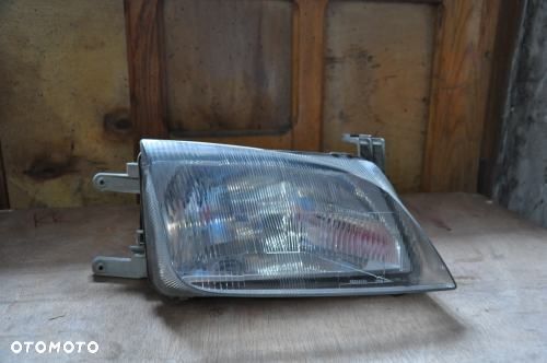 SUZUKI SWIFT MK4 96-04 PRAWY REFLEKTOR ORYGINAŁ - 1