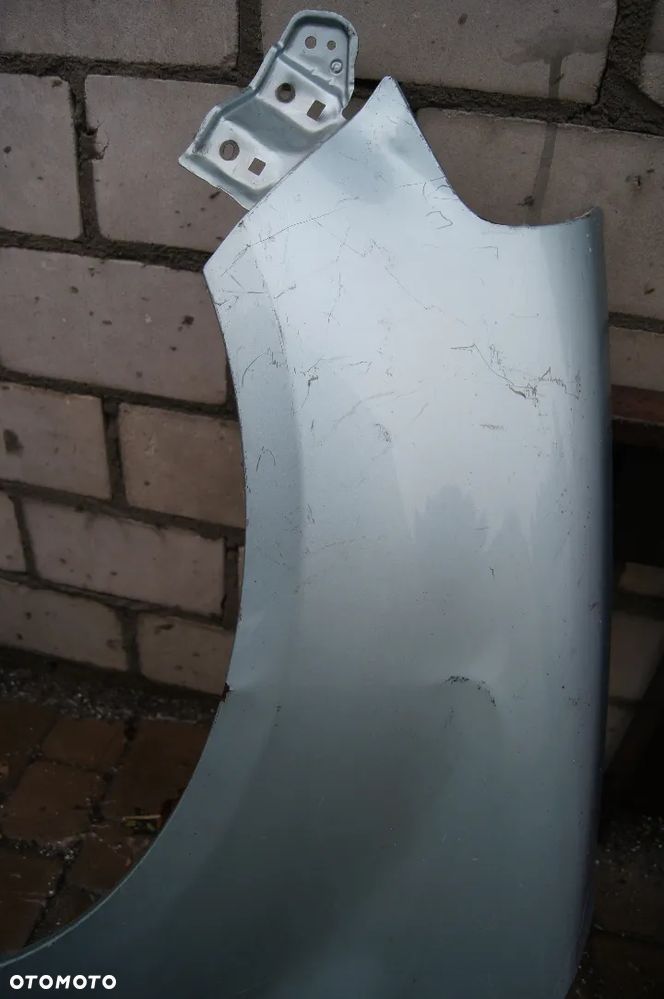 SUZUKI SX4 06-12 BŁOTNIK PRZEDNI LEWY - 2