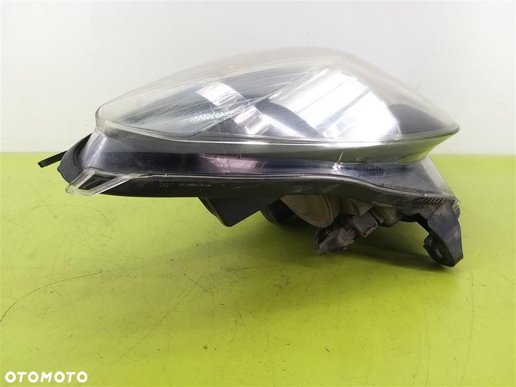 Reflektor lampa przód prawa Opel Astra III H 2004-2013 HELLA  1EG27037002 - 7