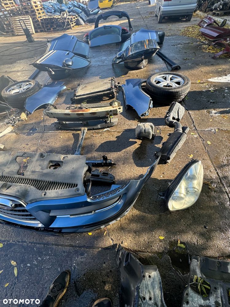 Subaru tribeca b9 maska osłona pod silnik lampy przód filtr obudowa filtra zderzak przód wzmocnienie górne pas belka przód chłodnica oleju chłodnica klimy zbiorniczek spryskiwaczy zawiasy maski błotnik prawy lewy węże wspomagania drzwi prawe lewe przednie tylne progi felgi koła klapa tył lampy tył belka tył zderzak tył - 3