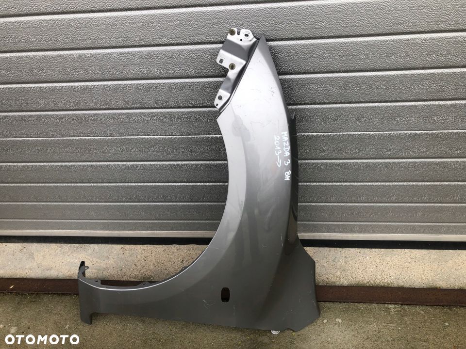 BŁOTNIK PRZEDNI LEWY MAZDA 3 BM 2013-- - 1